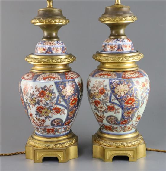 A pair of Imari vases ormolu mounted as lamps, H. 17.5in. to fitting